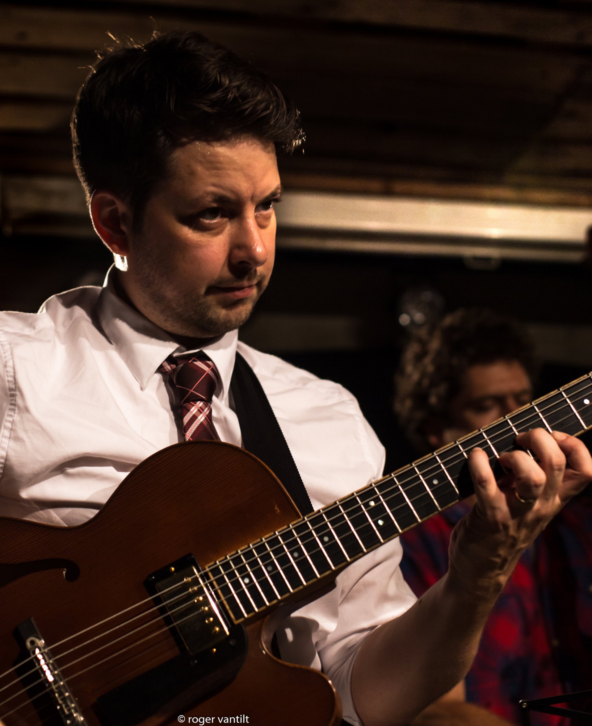 Lage Lund playing guitar in performance